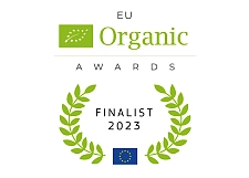 Auf dem Bild ist das Logo der EU Organic Awards zu sehen: Grüne Blätter in einem Kreis mit dem Text EU Organic Awards.