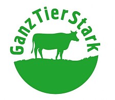 Logo des Projektes in grüner Farbe mit dem Schriftzug GanzTierStark und grüner Kuh auf grüner Wiese